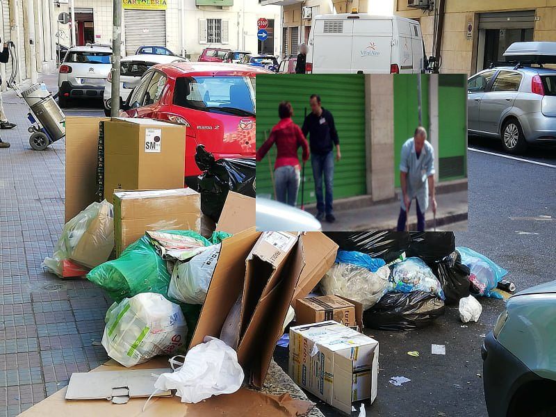 Cagliari, la spazzatura sommerge via Corelli: i commercianti ripuliscono la strada a loro spese