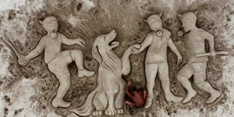 Cane sordo e cieco massacrato di botte e morto: una scultura di sabbia per ricordarlo