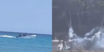 Porto Pino, festa in spiaggia dopo lo sbarco di un gruppo di migranti tra i bagnanti: razzi sparati in aria e fumogeni