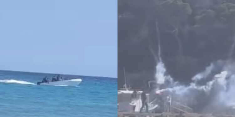 Porto Pino, festa in spiaggia dopo lo sbarco di un gruppo di migranti tra i bagnanti: razzi sparati in aria e fumogeni