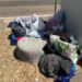 Poetto nel caos tra rifiuti, degrado e occupazione abusiva di spazi: la polemica esplode in consiglio comunale