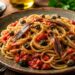 La cultura nel piatto, spaghetti con capperi, acciughe e pomodoro