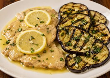 La cultura nel piatto, due ricette per un menù perfetto: scaloppine al limone e melanzane grigliate al profumo di aglio e prezzemolo